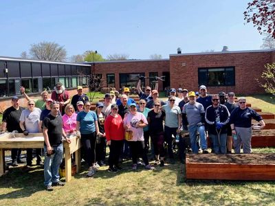 volunteers building gardens at Negaunee school